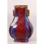 A Chinese stoneware porcelain vase with lug handles, high fired blue and red flambé glaze, impressed