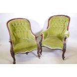 Two Victorian walnut easy chairs with button back upholstery, raised on carved cabriole supports