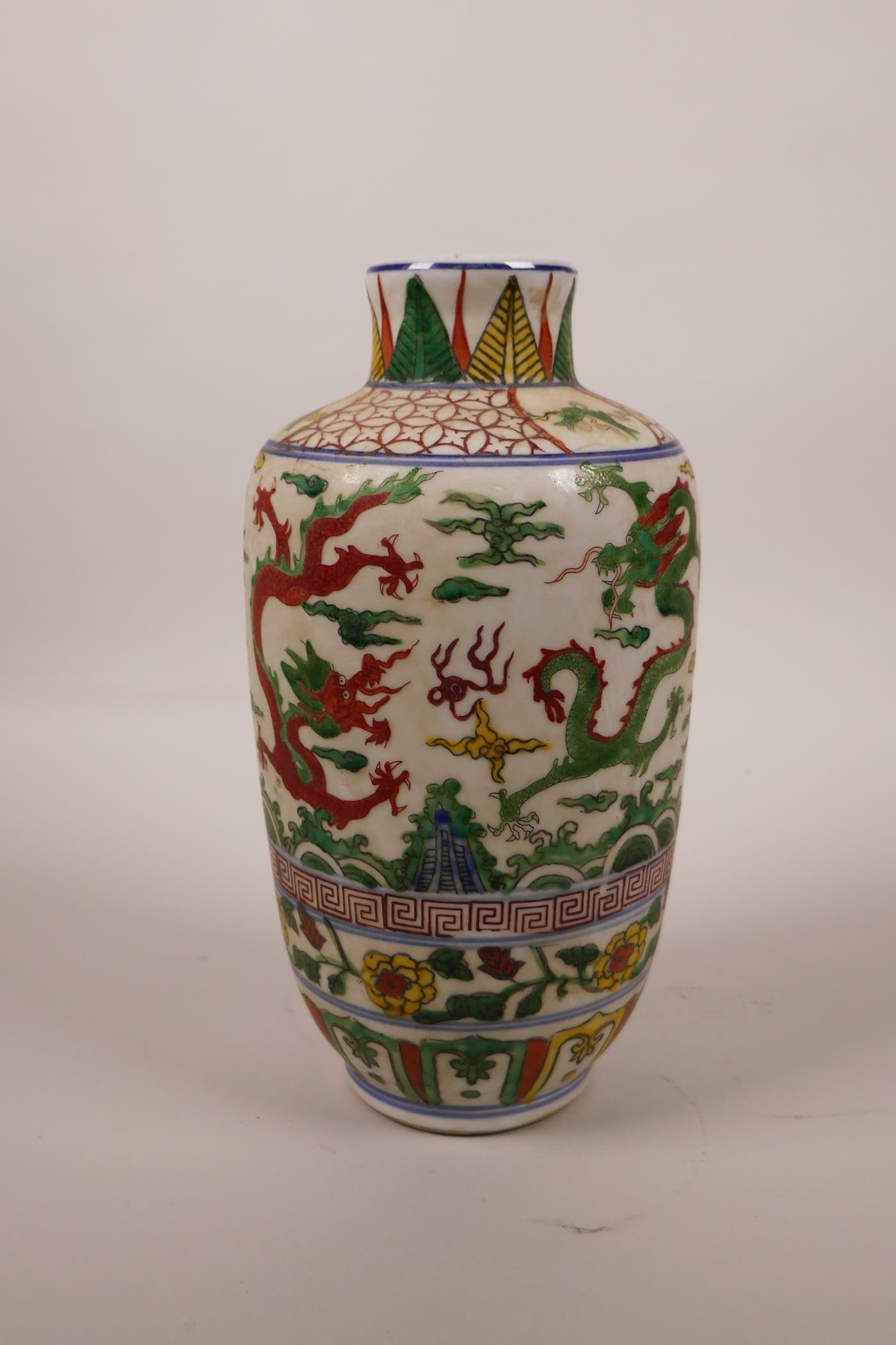 A Chinese wucai porcelain vase decorated with dragons chasing the flaming pearl, 6 character mark to - Image 3 of 4