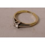 An 18ct gold, platinum solitaire diamond engagement ring, size O/P, gross 2.3 grams