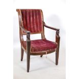 An early C19th French mahogany Empire style open armchair with Egyptianesque decoration, A/F