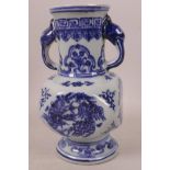 A Chinese blue and white porcelain vase with square form baluster body and elephant mask handles,