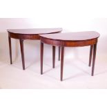 A pair of Georgian mahogany 'D' end tables, raised on square tapering supports, 22" x 44" x 29"