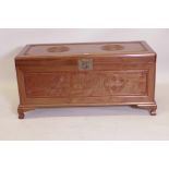 A Chinese hardwood blanket chest, with carved decoration, bears label George Zee and Co. Ltd.