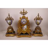 A French Sevres style porcelain and ormolu clock garniture, the movement striking on a bell, 17"