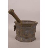 A Persian C14th bronze pestle and mortar of octagonal form, 4" high x 5" diameter