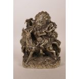 A Sino-Tibetan silvered metal figure of a wrathful deity on horseback, impressed double vajra mark