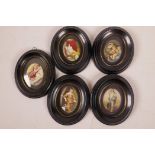 Five Edwardian ebonised oval miniature picture frames, apertures 3" x 2¼", containing silk prints of