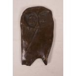 A bronze plaque of a stylised owl, 4" x 7"