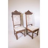 A pair of C19th Italian high back chairs with carved and parcel gilt decoration and crests, 54" high