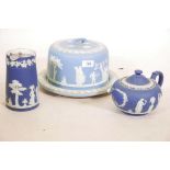 A Wedgwood blue Jasperware cheese dish, 11" diameter, a teapot, and jug with silver plated cover