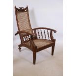 An Anglo-Indian plantation chair with a cane back and seat, 38" high