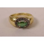An 18ct yellow gold emerald and diamond set ring, approximate size 'N'