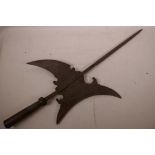 A Persian steel halberd with engraved decoration, 29" long