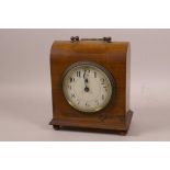 A walnut cased dome shaped mantel clock with French timepiece movement, with white dial and Arabic