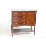 An Edwardian inlaid mahogany music cabinet with four folio drawers and side cupboard raised on