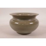 A Chinese celadon glazed pottery bowl, 5" diameter