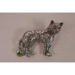 A 925 silver brooch in the form of a cat with ruby set eyes, 1½" wide