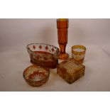 A flash cut amber glass square section trinket box, 4½" square, together with four other amber glass