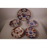 Four Japanese Imari plates with shaped rims, a Satsuma dish, A/F, largest 12" diameter