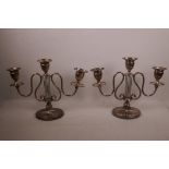 A pair of silver plated two branch, three sconce candlesticks of lyre form, 13" wide x 10" high