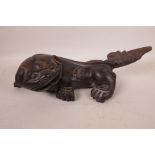 A Chinese carved hardwood figure of a kylin, 14½" long