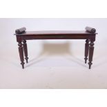 A C19th mahogany window seat, raised on turned and hexagonal supports, stamped G. Ibison, 36" x