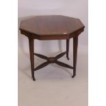 A Victorian inlaid rosewood centre table, with octagonal top, raised on tapering supports united