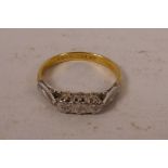 An 18ct gold, platinum set, three stone diamond ring, size 'P/Q'