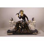 A French marble and bronzed spelter Art Deco figure, with resin face and hands, 20½" x 15½"