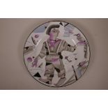 A Russian style porcelain cabinet plate decorated with a constructivist style figure, mark to