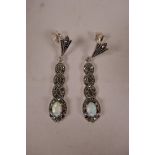 A pair of Art Deco style 925 silver drop earrings set with marcasite, rubies and opalites, 1½" drop