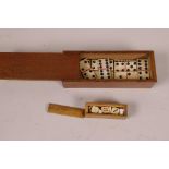 A small mahogany box of miniature bone dominoes, 3¼" long, together with miniature hardwood box
