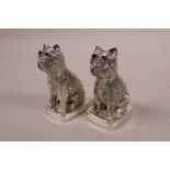 A pair of novelty condiments in the form of dogs set with ruby coloured eyes, marked 800, 2" high