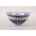 A Chinese blue and white porcelain bowl with floral decoration, 6 character mark to base, 8"