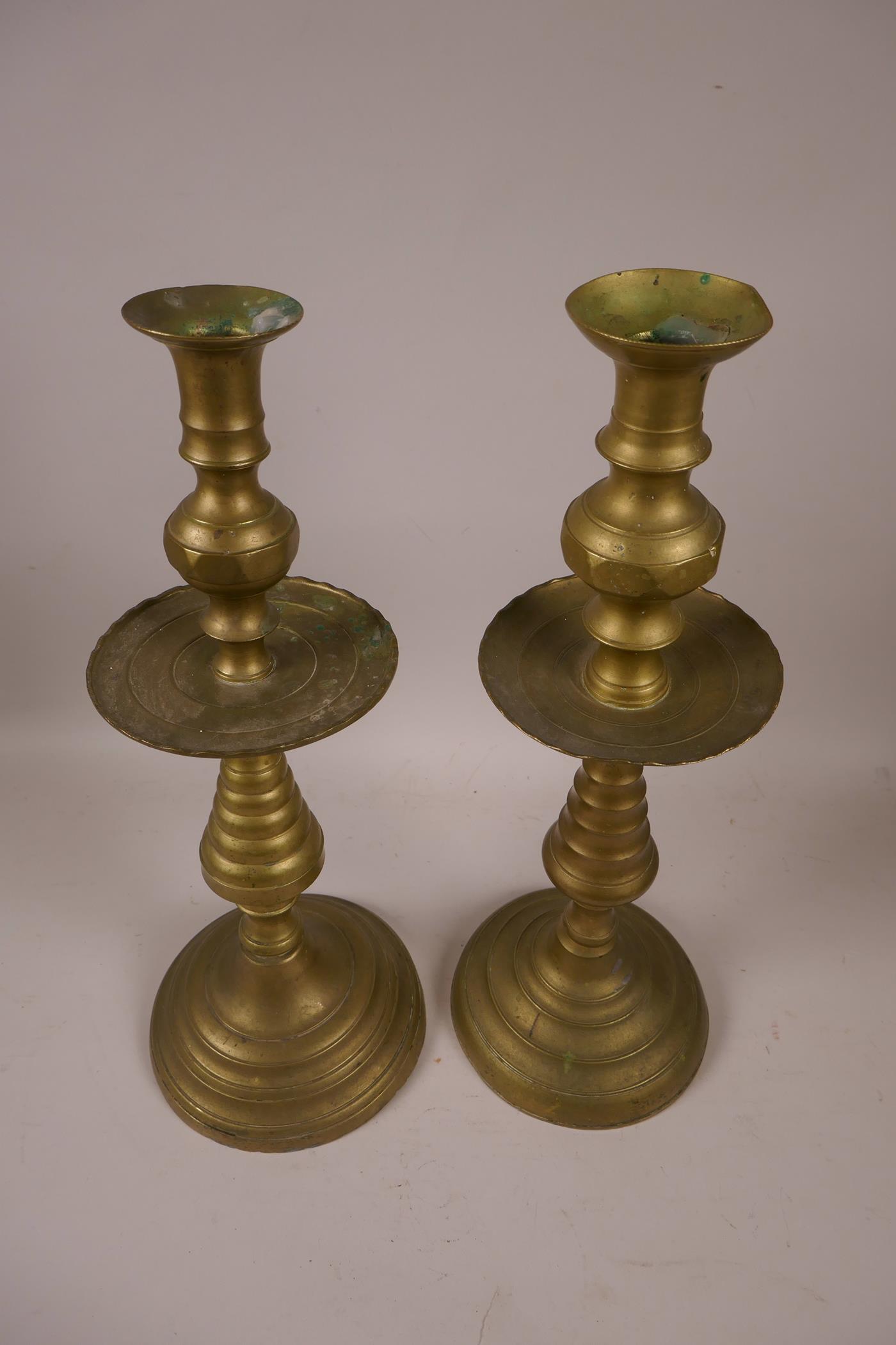 A near pair of brass candlesticks, 14½" high - Image 2 of 2