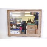 A wall mirror with swept gilt frames, 28" x 36"