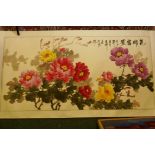A Chinese scroll painted with bright flowers and calligraphy