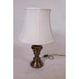 A large brass table lamp and shade, 24" high