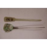 A Chinese grey jade hairpin with carved lotus flower decoration, 6" long, and another white metal