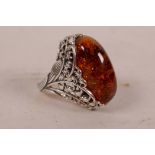 A 925 silver dress ring set with a faux amber stone, approximate size 'Q'