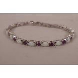 A silver, ruby and opalite set panel bracelet, 7" long