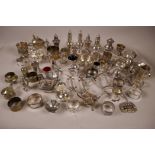A box of small silver plated items including condiments, candlesticks, knife rests, tankards etc