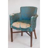 A tub shaped bedroom chair, raised on mahogany square supports united by cross stretchers, first