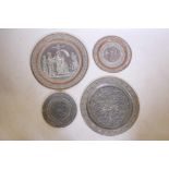 A collection of four Indo-Persian copper plaques with repoussé decoration of figures and birds,