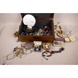 A hardwood jewellery box containing costume jewellery and watches including a silver mounted cameo