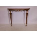 A mahogany veneered 'D' shaped console table, with ebonised and parcel gilt decoration, raised on