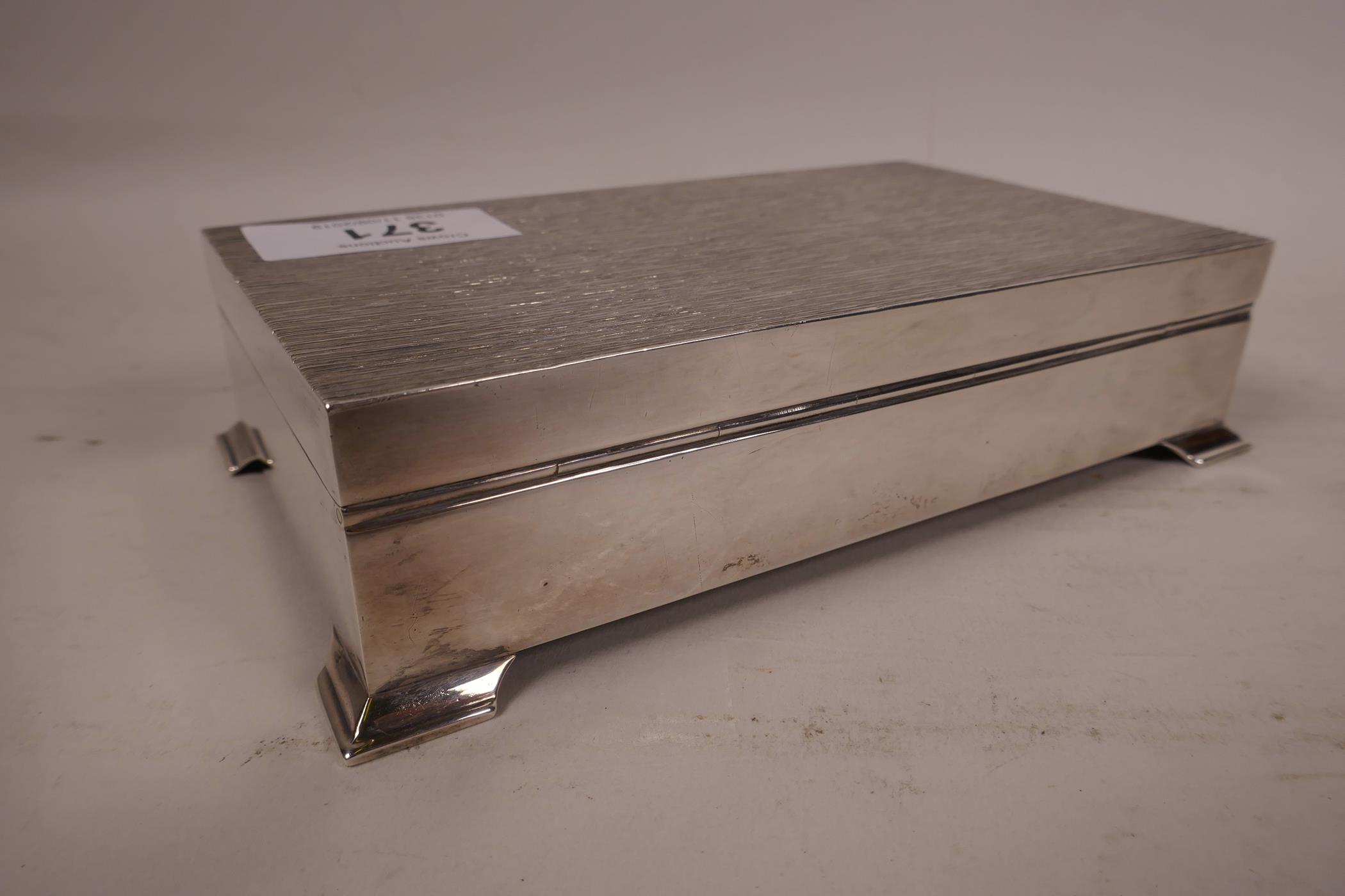 A silver cigarette box, hallmarked Birmingham 1975, 6" long, 3½" wide x ¼" high - Image 3 of 6