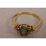 An 18ct gold aquamarine and diamond dress ring, size 'Q', gross 1.9 grams