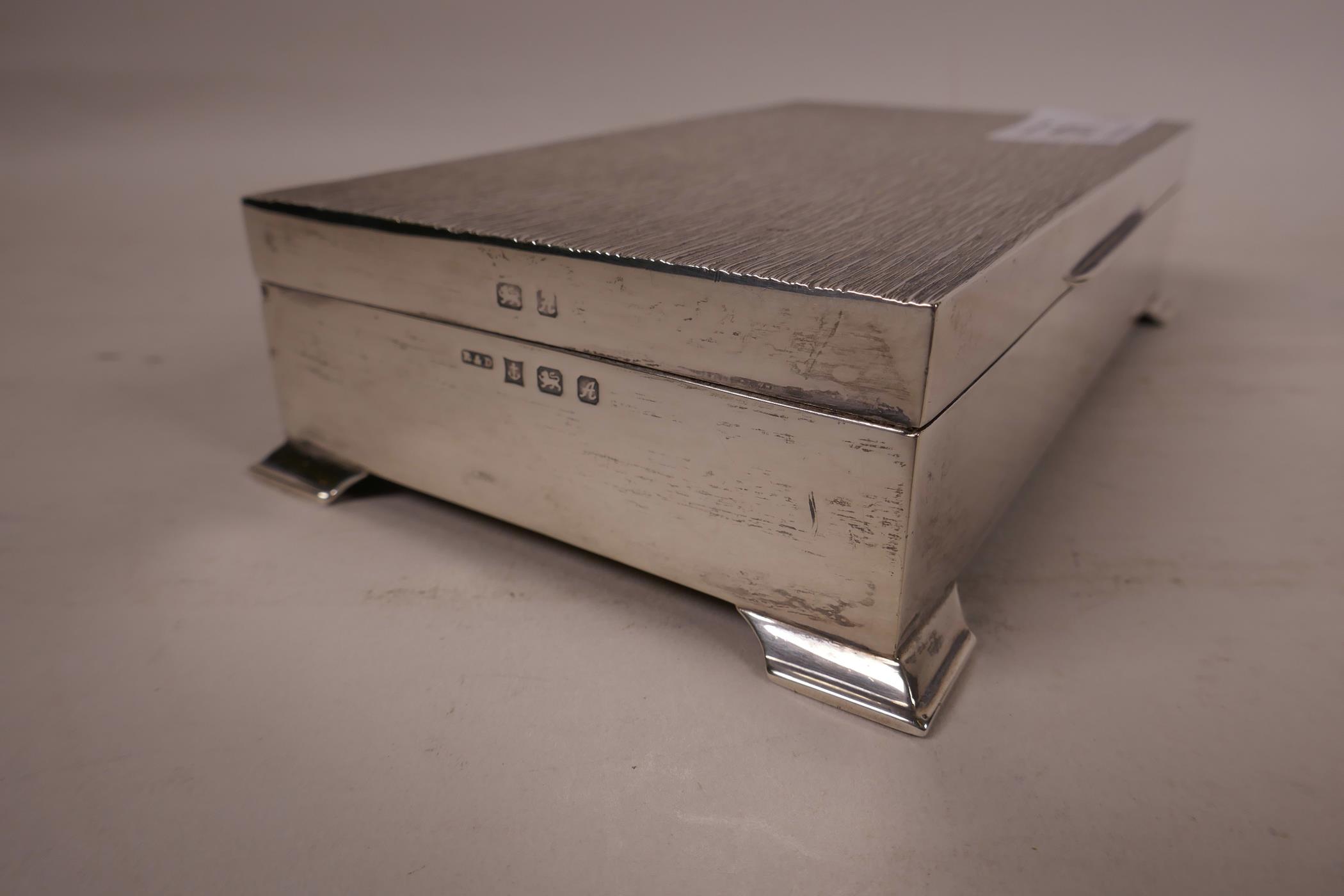 A silver cigarette box, hallmarked Birmingham 1975, 6" long, 3½" wide x ¼" high - Image 2 of 6